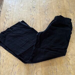 Women's Black linen elastic waist pants raw hem with raw detail down each leg.